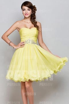 Short formal dress in yellow tone with beaded details