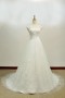 Robe de mariée blanche empire dentelle ceinturée fleurs appliquées