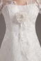 Robe de mariée dentelle ornée d'une fleur à manche 3/4