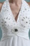 Robe de mariée courte col américain ornée de bijoux