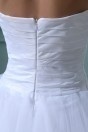 Robe de mariée plage bustier ruchée courte devant longue derrière