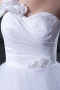 Robe de mariée princesse asymétrique ornée de fleurs