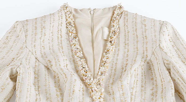 robe maille longue col v décoré de bijoux