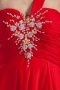 Robe rouge de soirée asymétrique ornée de bijoux